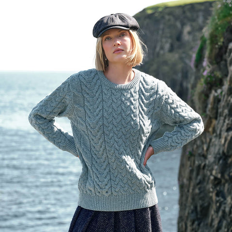Image featuring the Women's Cable Knit Crew Neck Sweater in mermaid, crafted with authentic Irish cable knit patterns and a timeless crew neck silhouette, inspired by Ireland's rich knitting heritage and traditional craftsmanship.